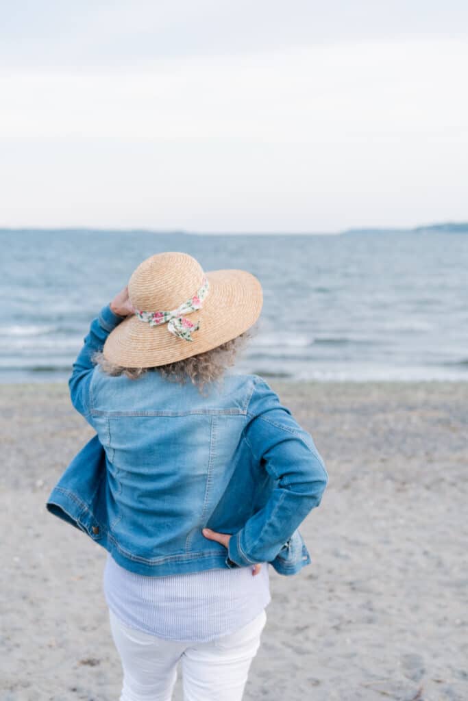 women poses at island park beach