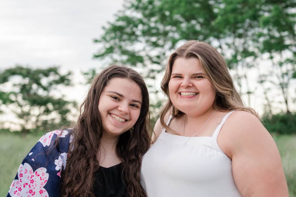 cousins smile for beach portraits