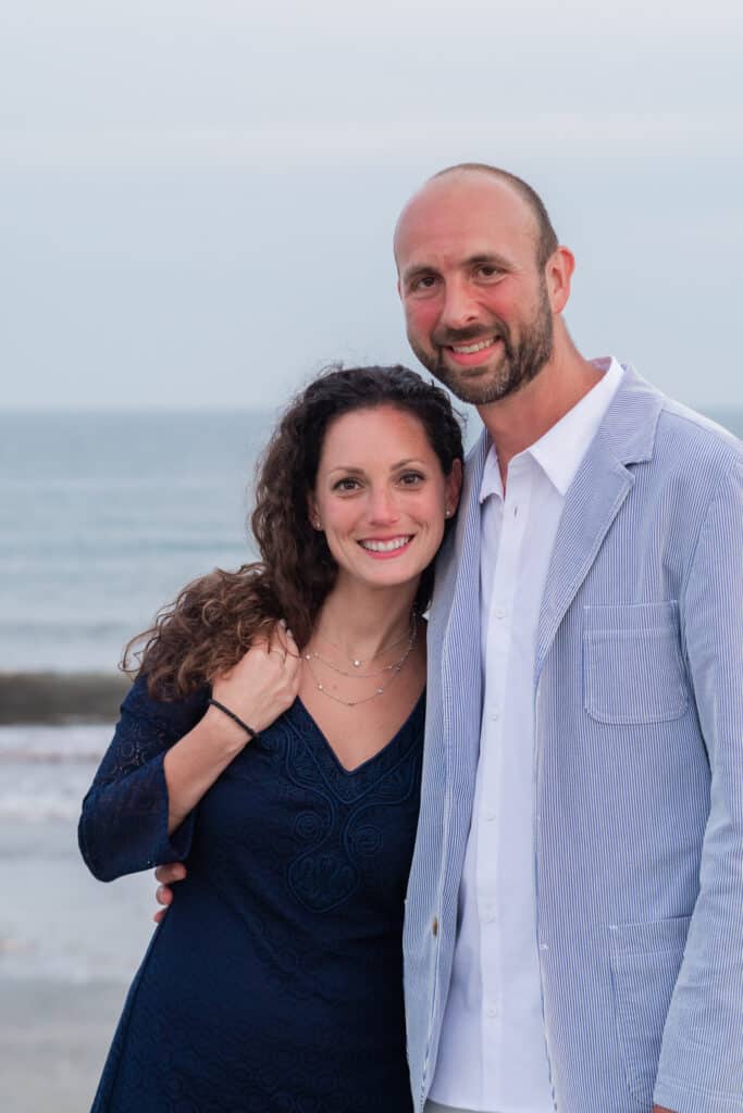 couple poses for portraits after newport proposal