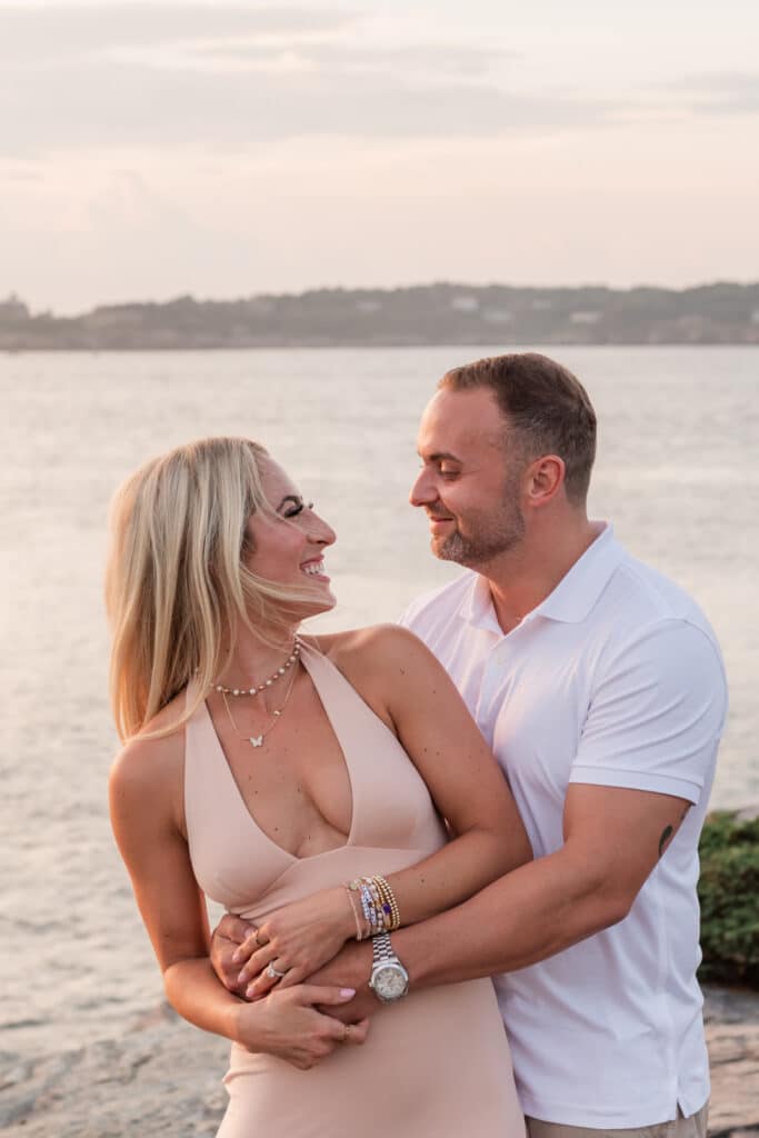 couple smiles after engagement at castle hill