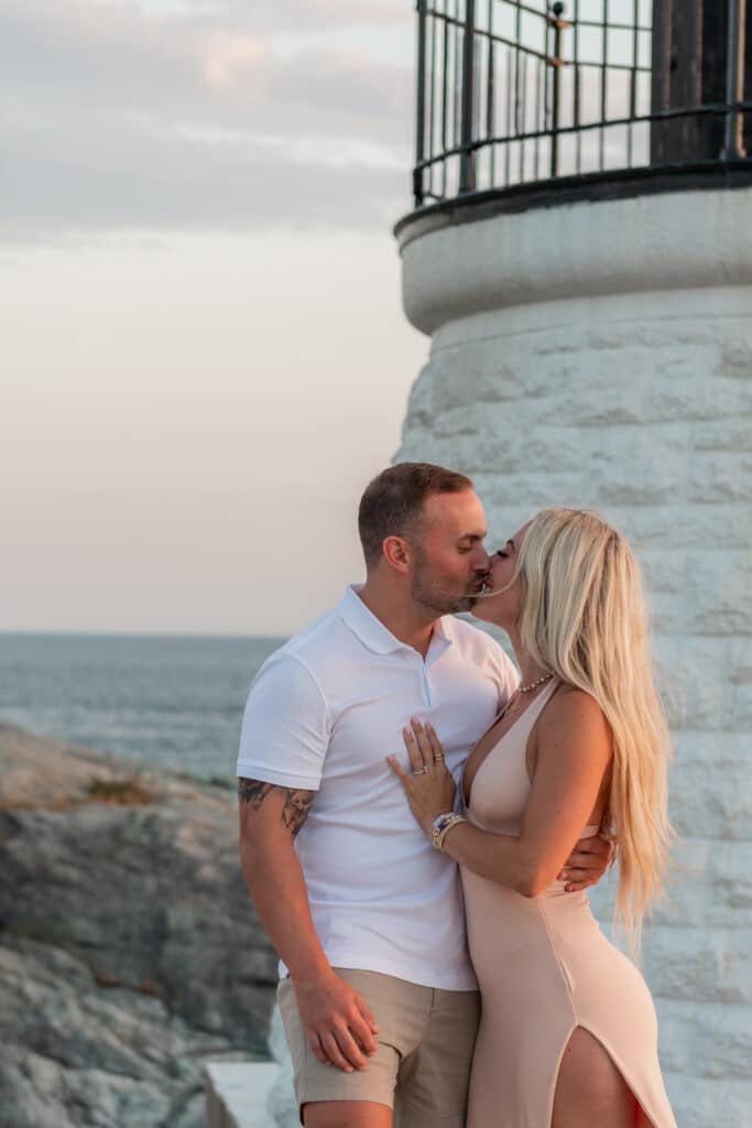 couple kisses after castle hill proposal