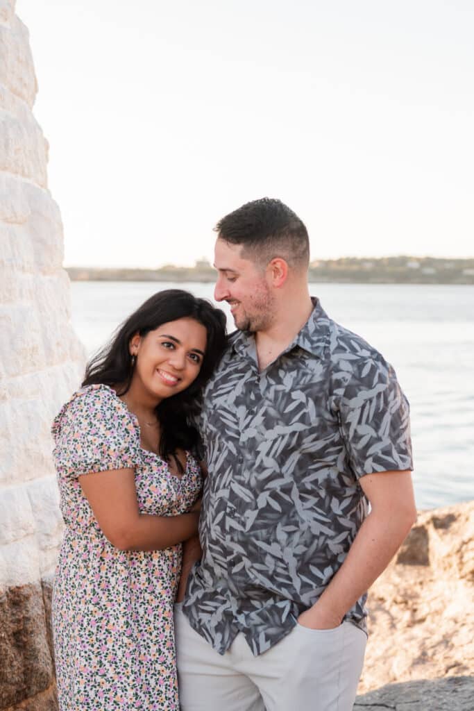 couple smiles after proposal in newport ri