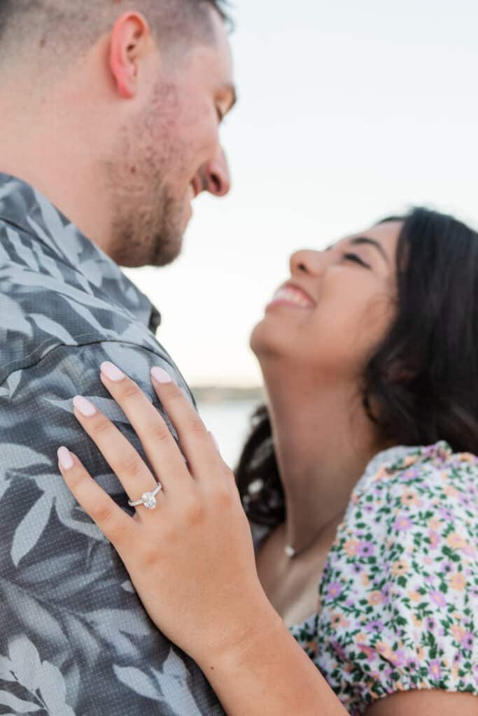 engaged couple smiles