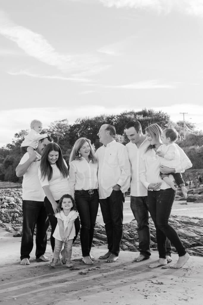 family laughs for family portraits