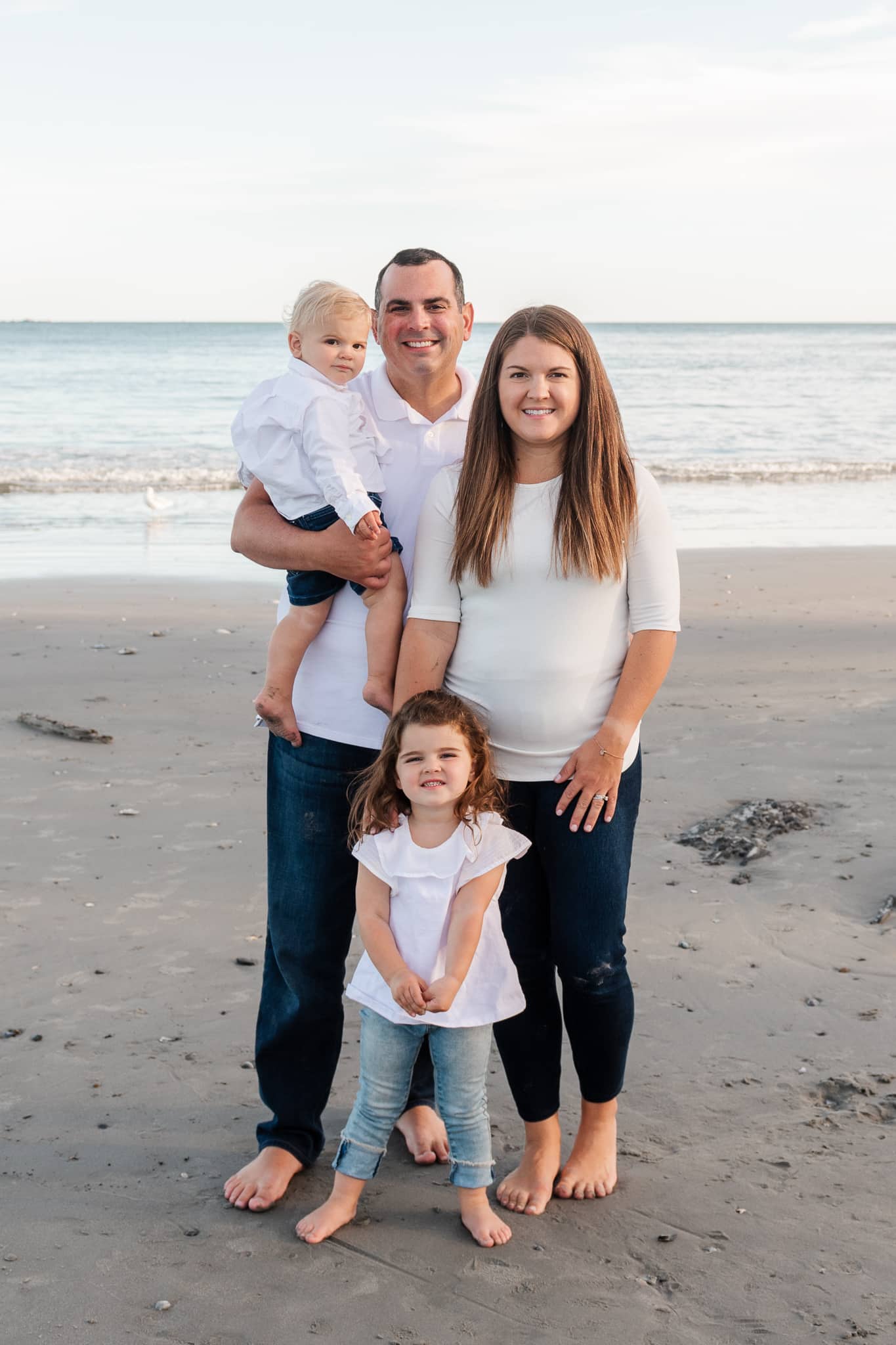 family portraits on the beach with two small children