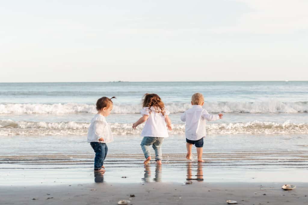 children play on beach in middletown