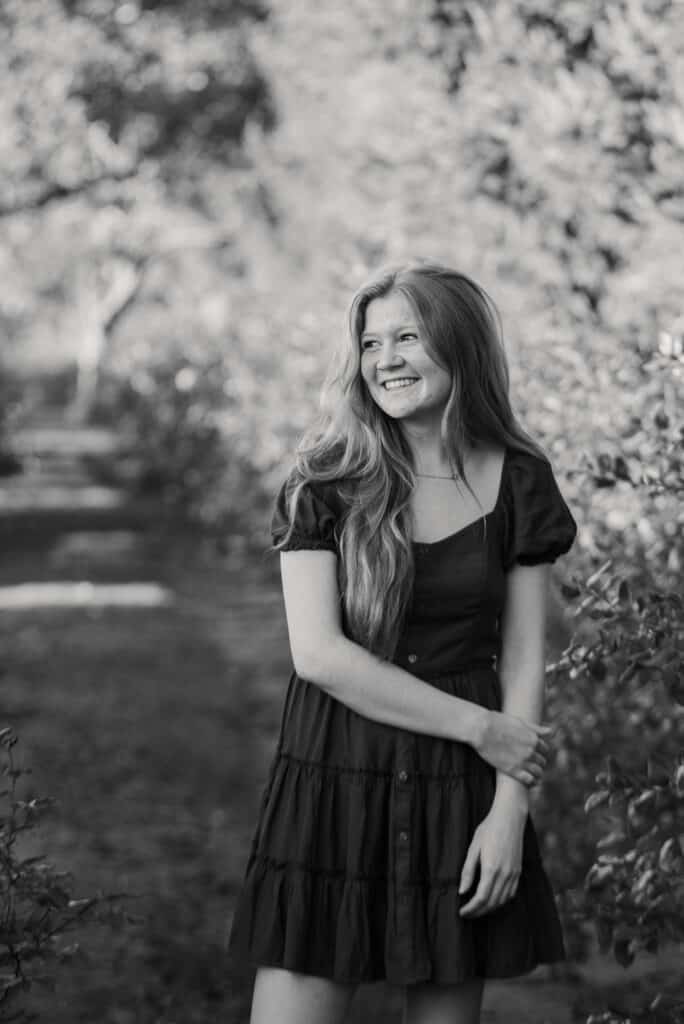 girl smiles for senior portraits