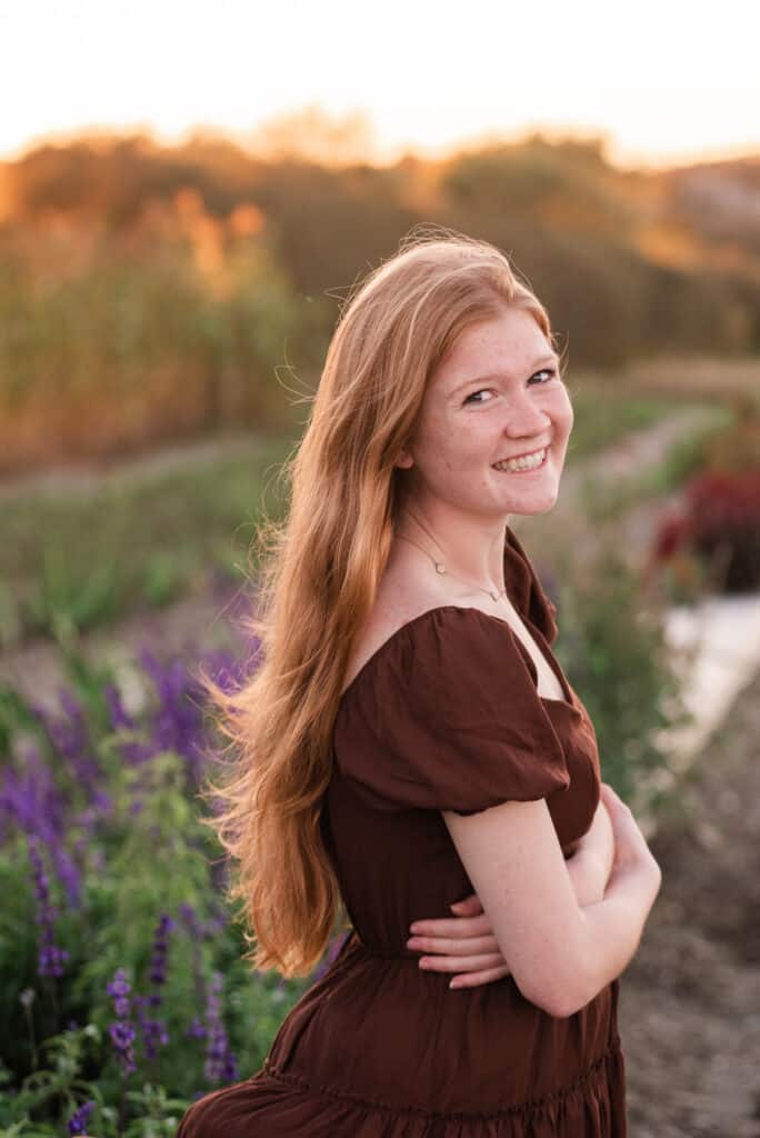 girl smiles near pick your own flowers at sweet berry farm