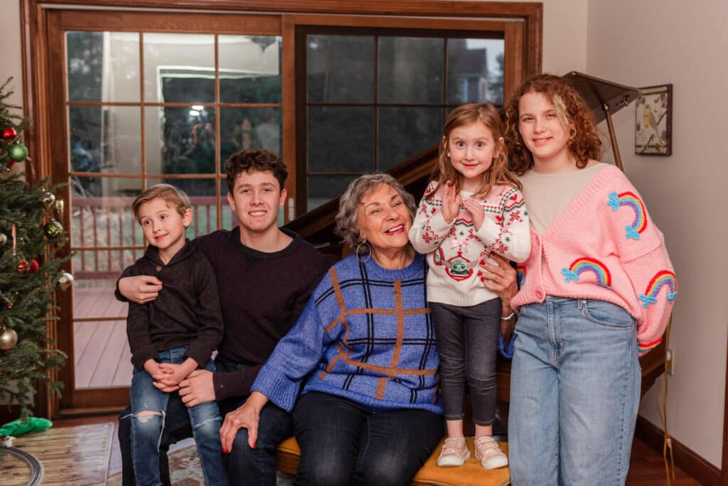 great grandma and great grandchildren pose for family portrait