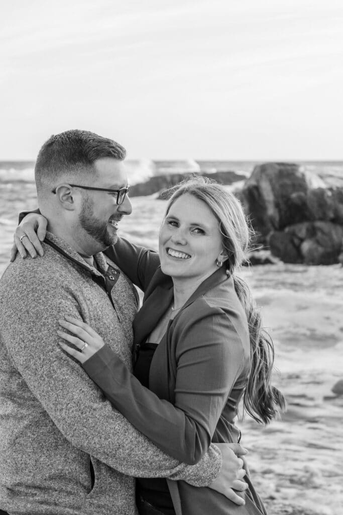 couple smiles after newport surprise engagement