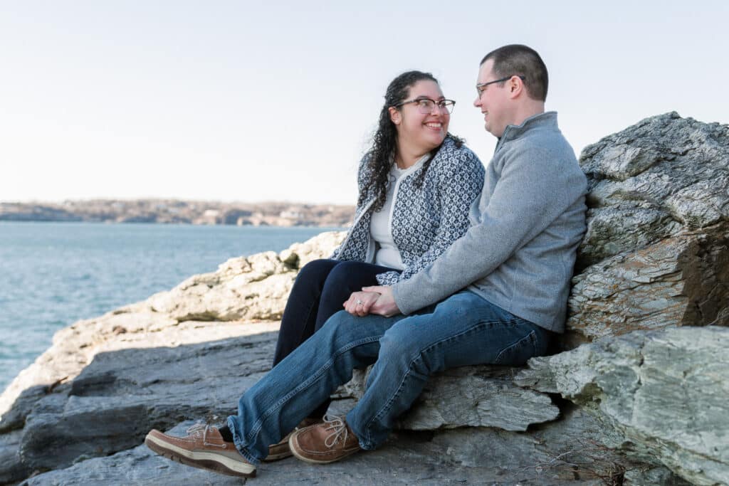 couple smiles after proposal at castle hill light