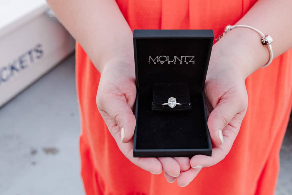 engagement ring and orange dress